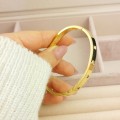 Bransoletka STAL CHIRURGICZNA sztywna bangle klasyczna z kryształkami złota