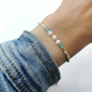 Bransoletka kryształki na sznurku  ze STALI CHIRURGICZNEJ kremowa