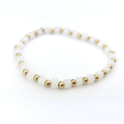 Bransoletka STAL CHIRURGICZNA elastyczna białe kamienie kulki złote 