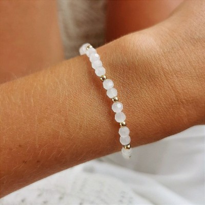 Bransoletka STAL CHIRURGICZNA elastyczna kryształki białe kulki złota 