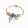 Bansoletka modułowa charms złota zawieszki cyrkonie